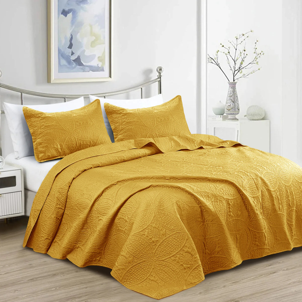 Ochre quilted bedspread set with matching pillowcases and embossed coin pattern