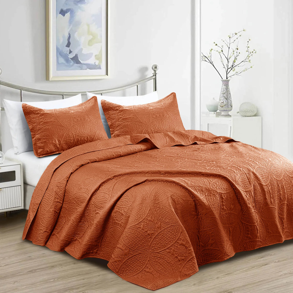 Rust orange quilt bedding set with embossed floral coin pattern